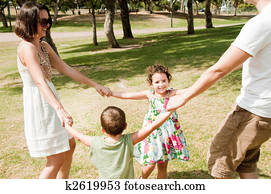 cute family playing in the park cute family playing in the park