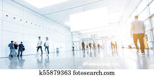 blurred people walking in a modern hall blurred people walking in a modern hall
