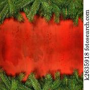 Branches of pine against rustic red wood