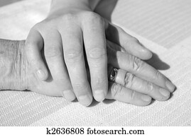 hands of young and a senior woman for comfort hands of young and a senior woman for comfort