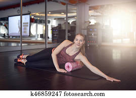 Woman using foam roller