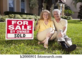 Senior Couple With For Sale Sold By Owner House SIgn