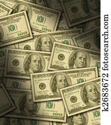 One hundred dollar bills lying flat, dramatically lit.