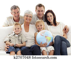 Big family on sofa holding a terrestrial globe Big family on sofa holding a terrestrial globe