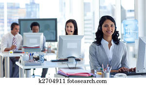 Businesswoman with a headset on in a call center Businesswoman with a headset on in a call center