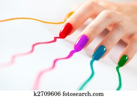 Young woman hand with multicoloured nails Young woman hand with multicoloured nails