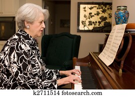 Senior Woman Playing Piano