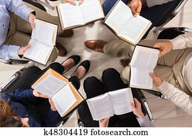 Group Of Diverse People Reading Books