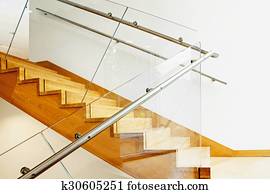Modern interior with wooden stairs Modern interior with wooden stairs