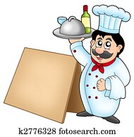 Chef holding meal with wooden table Chef holding meal with wooden table