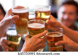 happy friends drinking beer at bar or pub happy friends drinking beer at bar or pub