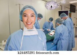 Medical students practicing surgery on model