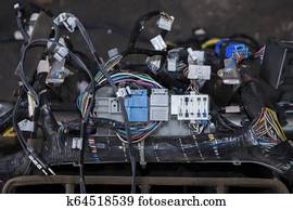 Wires from the car wiring lies in the cabin of the dismantled car with