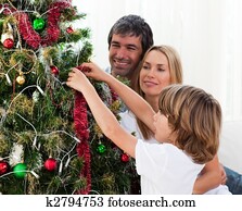 Little boy decorating a Christmas