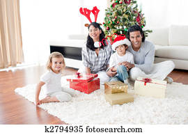 Smiling family celebrating christma