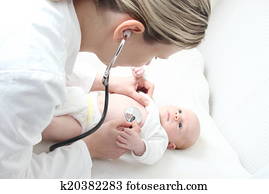 Pediatrician with Baby checking possible heart defect Pediatrician with Baby checking possible heart defect