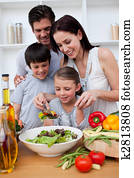 Happy family cooking together Happy family cooking together