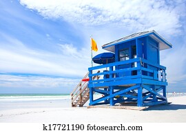 Siesta Key Beach, Florida USA, colorful lifeguard house on a beautiful summer day with ocean and blue cloudy sky