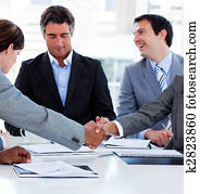 Close-up of successful business people closing a deal Close-up of successful business people closing a deal