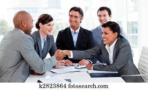 Happy business people closing a deal Happy business people closing a deal