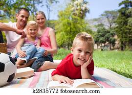 Smiling little boy reading Smiling little boy reading