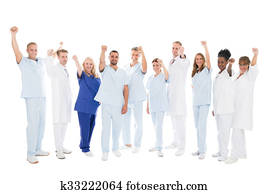 Multiethnic Medical Team Standing With Arms Raised