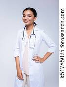Smiling woman posing in a medical uniform