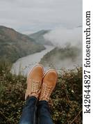 boots in the foreground on the panoramic view of the Valley, concept of adventure and travel