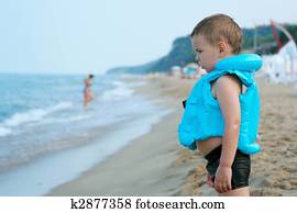 The boy on the beach. In anticipation of the surf 