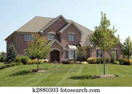 Luxury brick home with arched entry