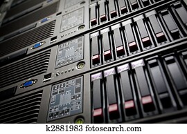 Servers stack with hard drives in a datacenter Servers stack with hard drives in a datacenter
