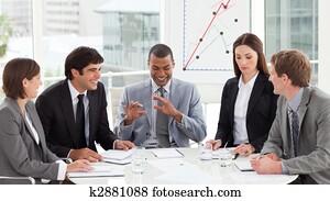 Smiling business team discussing a budget plan