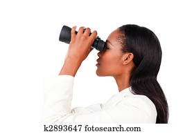 Charismatic businesswoman looking to the future through binoculars against a white background