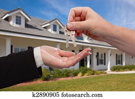 Handing Over the House Keys in Front of New Home Handing Over the House Keys in Front of New Home