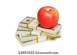 Red apple and dollar notes isolated on the white Red apple and dollar notes isolated on the white