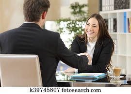 Businesspeople handshaking after negotiation