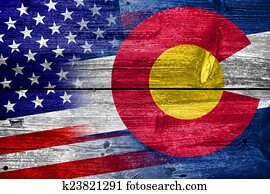 USA and Colorado State Flag painted on old wood plank texture USA and Colorado State Flag painted on old wood plank texture