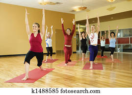Women in yoga class. Women in yoga class.