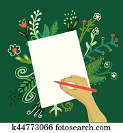 Hand writing on the paper with a pencil and flowers Hand writing on the paper with a pencil and flowers