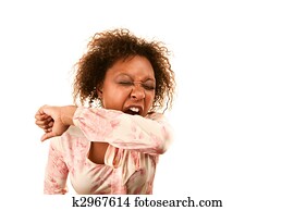 Woman sneezing into her sleeve to prevent disease spread