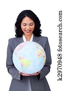 Confident ethnic businesswoman smiling at global business