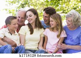 Extended family outdoors smiling Extended family outdoors smiling