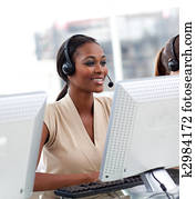 Female customer service agent in a call center Female customer service agent in a call center