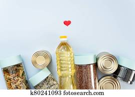 donation, happy volunteer charity, CSR social responsibility, hope concept. Cereals, various products, canned food, pasta and soap with place for text