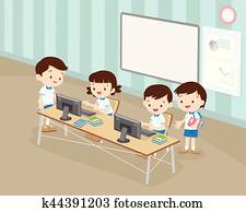students boy and girl are working with computer in classroom students boy and girl are working with computer in classroom