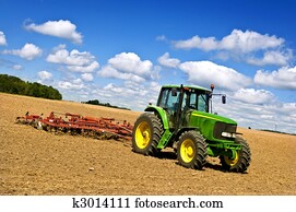 Tractor in plowed field Tractor in plowed field