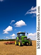 Tractor in plowed field Tractor in plowed field