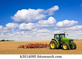 Tractor in plowed field Tractor in plowed field