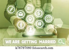 Conceptual hand writing showing We Are Getting Married. Business photo showcasing Engagement Wedding preparation Loving couple. Conceptual hand writing showing We Are Getting Married. Business photo showcasing Engagement Wedding preparation Loving couple.