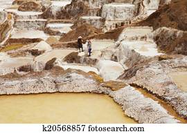 Detail of Salt ponds with people in the background, Maras, Peru